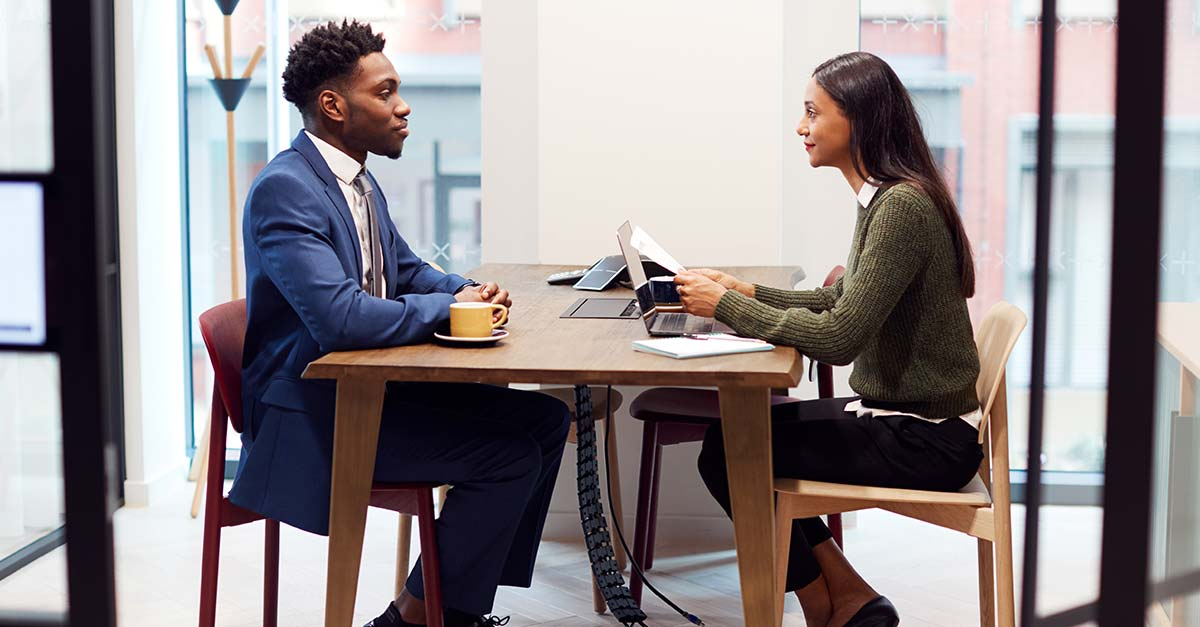 A professional being take through mock interview session